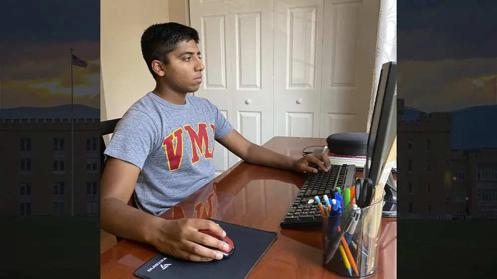 Jacob Benny working on computer