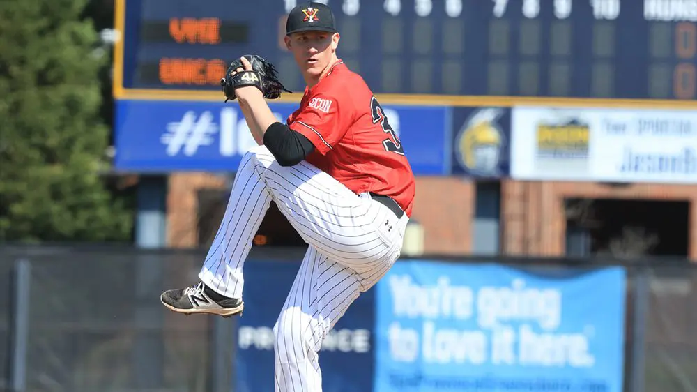 Josh Winder preparing to pitch a baseball.