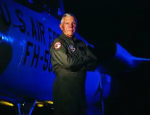 Col. Thomas H. Kirk Jr. '50B posing with arms crossed.