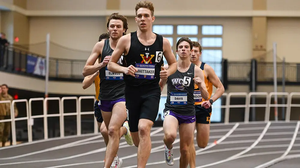 track athletes running on indoor track