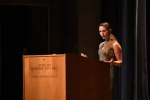 Rachael Denhollander speaking during leadership conference.