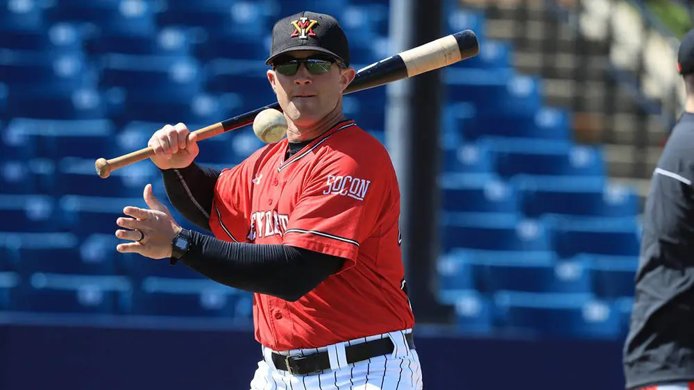 baseball player with bat and ball