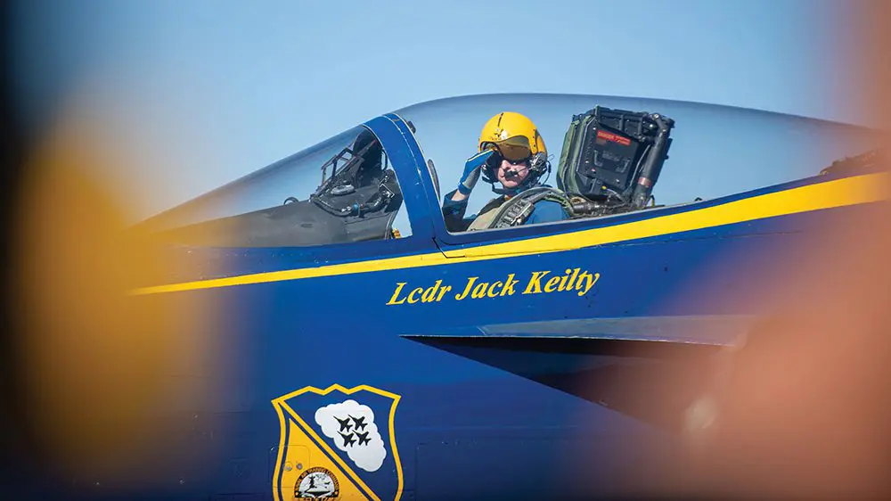U.S. Navy Cmdr. Jack Keilty ’10 saluting from aircraft