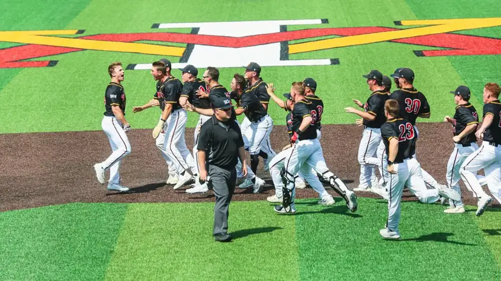 baseball team running onto field