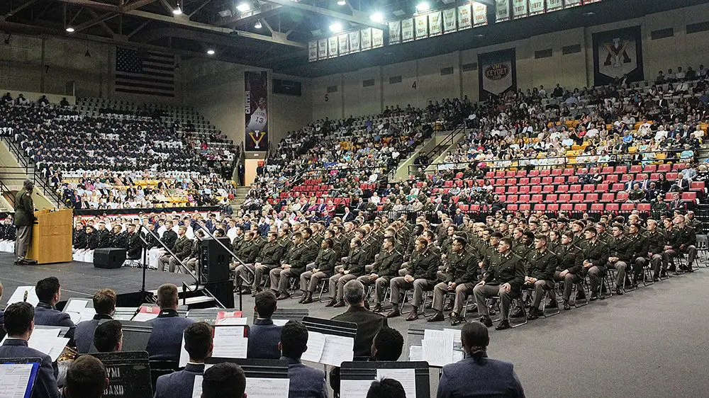 crowd of cadets in military uniforms seated in middle of Cameron Hall