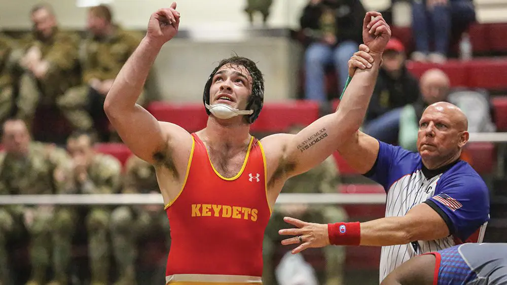 wrestler pointing skyward