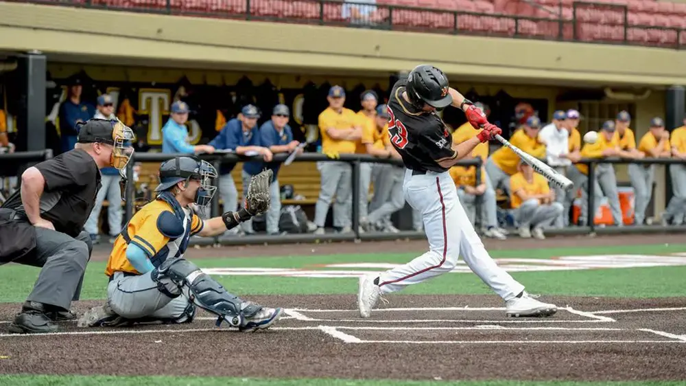 baseball player swinging bat