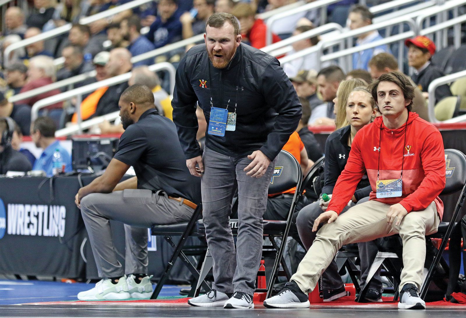 VMI wrestling coach Gibson coaching on sideline