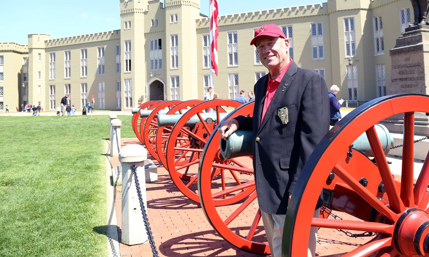 Rankin standing by cannons at Post