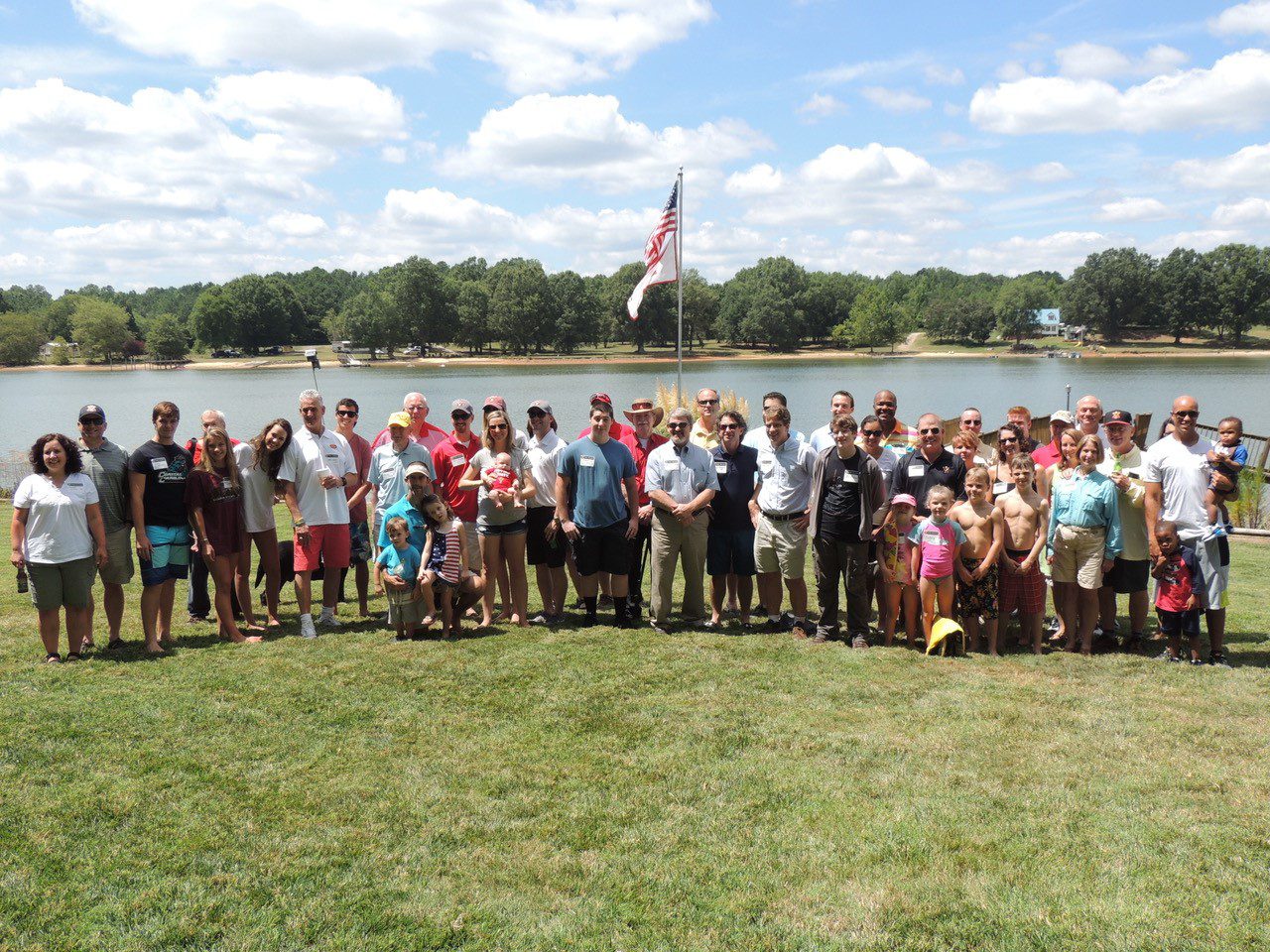 Charlotte chapter alumni standing by water