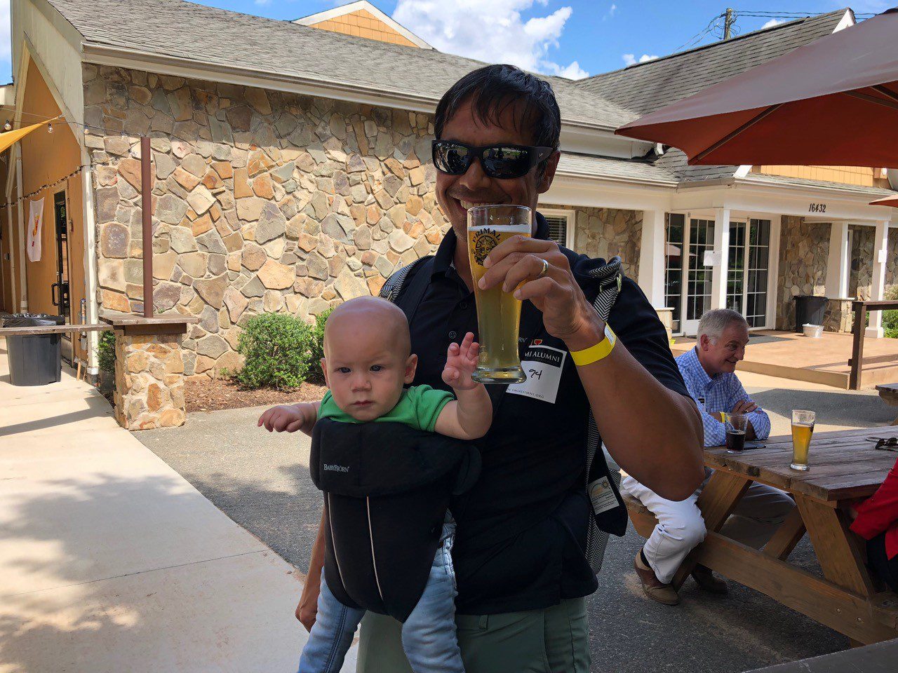 Charlotte chapter alumni standing with baby