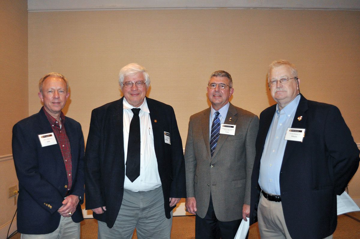 Fayetteville alumni standing at event