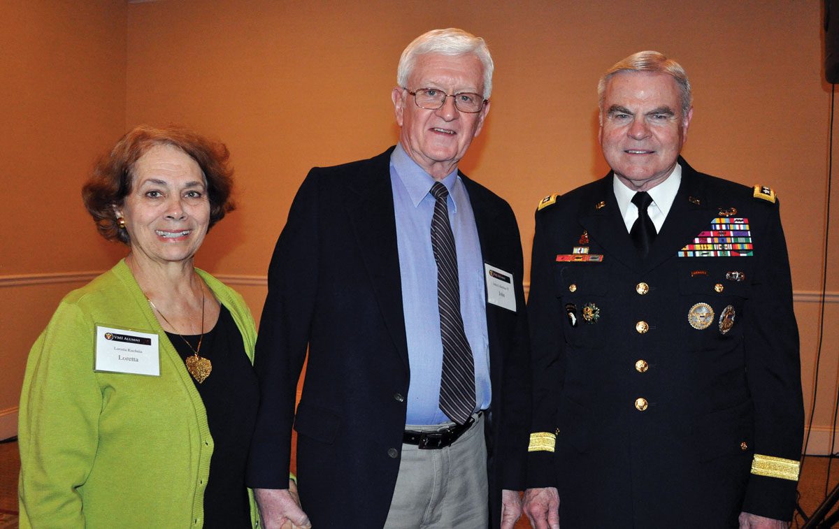 Fayetteville alumni standing at event