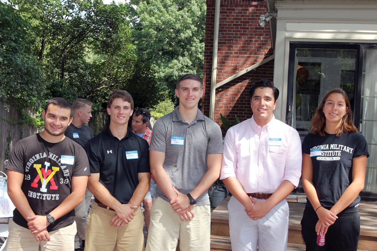 young men and women standing outside at chapter event