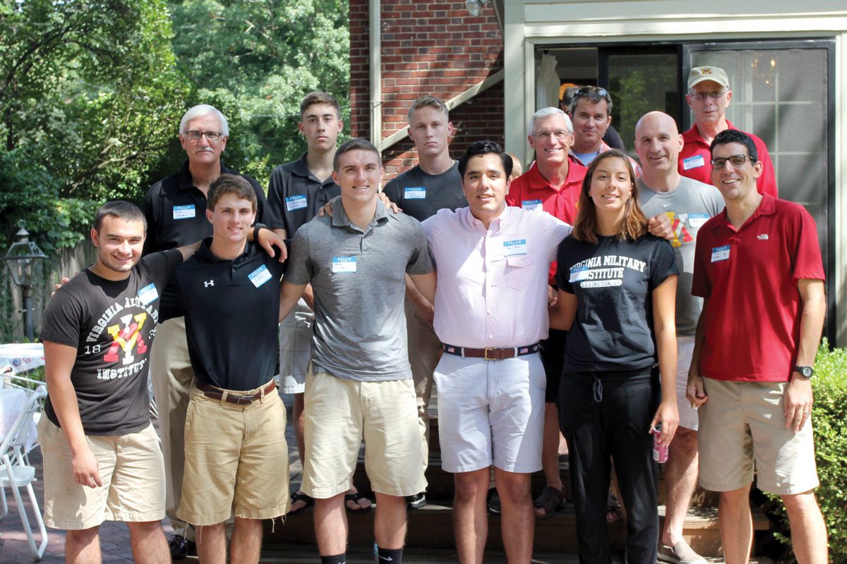 young men and women standing outside at chapter event