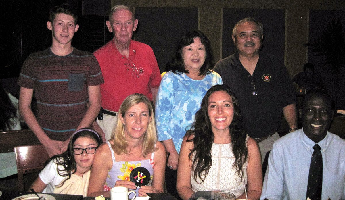 Hawaii chapter alumni sitting around dinner table