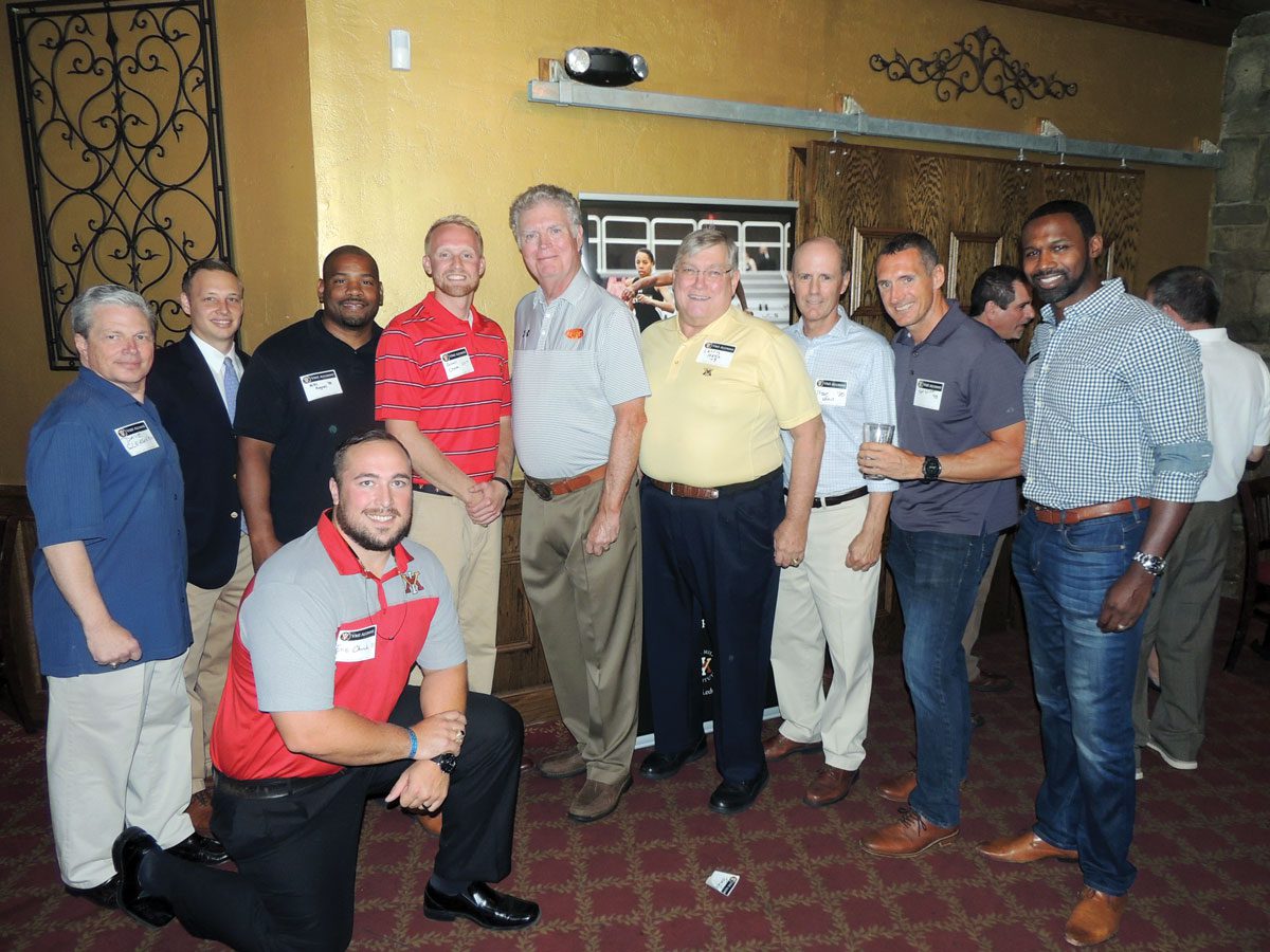 Alumni standing at Maryland chapter event