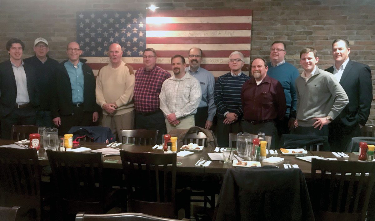 Minnesota Alumni standing at chapter event dinner