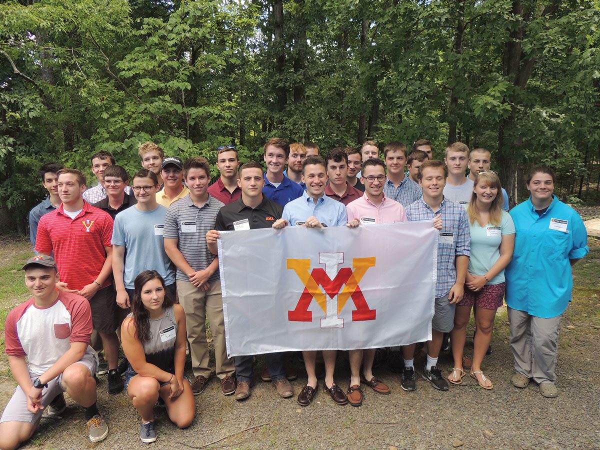 VMI alumni holding VMI flag at picnic