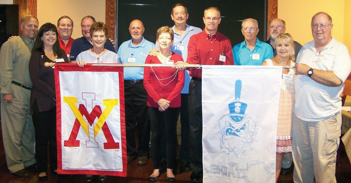 Panama City and Tallahassee chapter standing with vmi flag