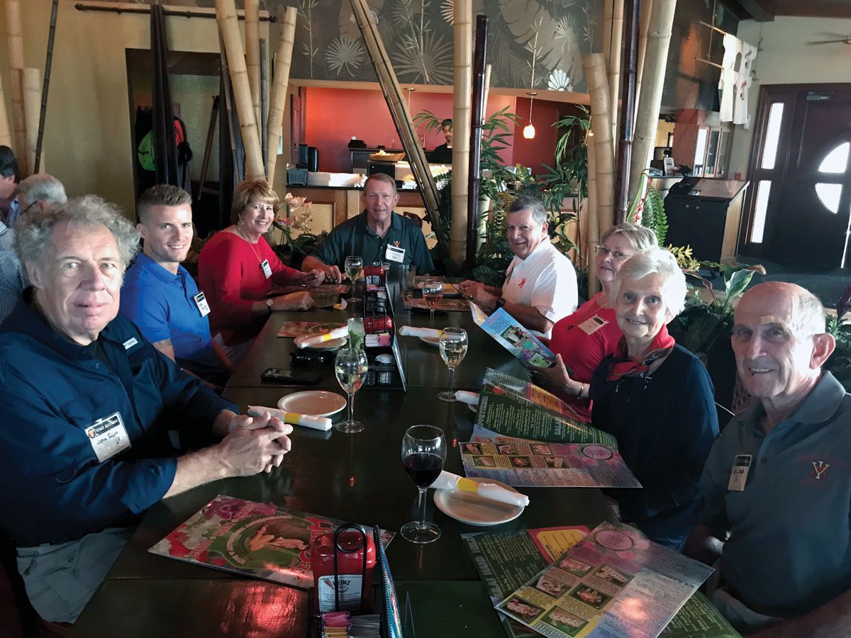 Tampa chapter alumni group at dinner table