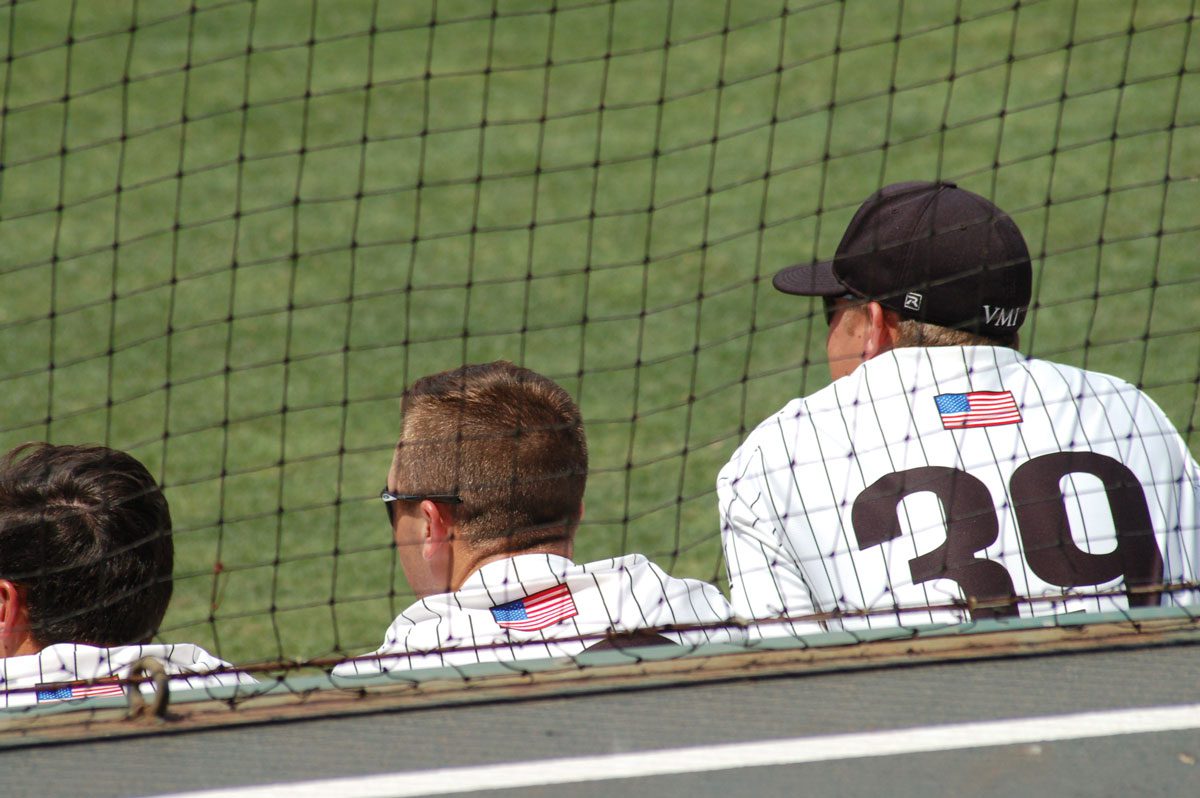 VMI baseball players sitting in dugout