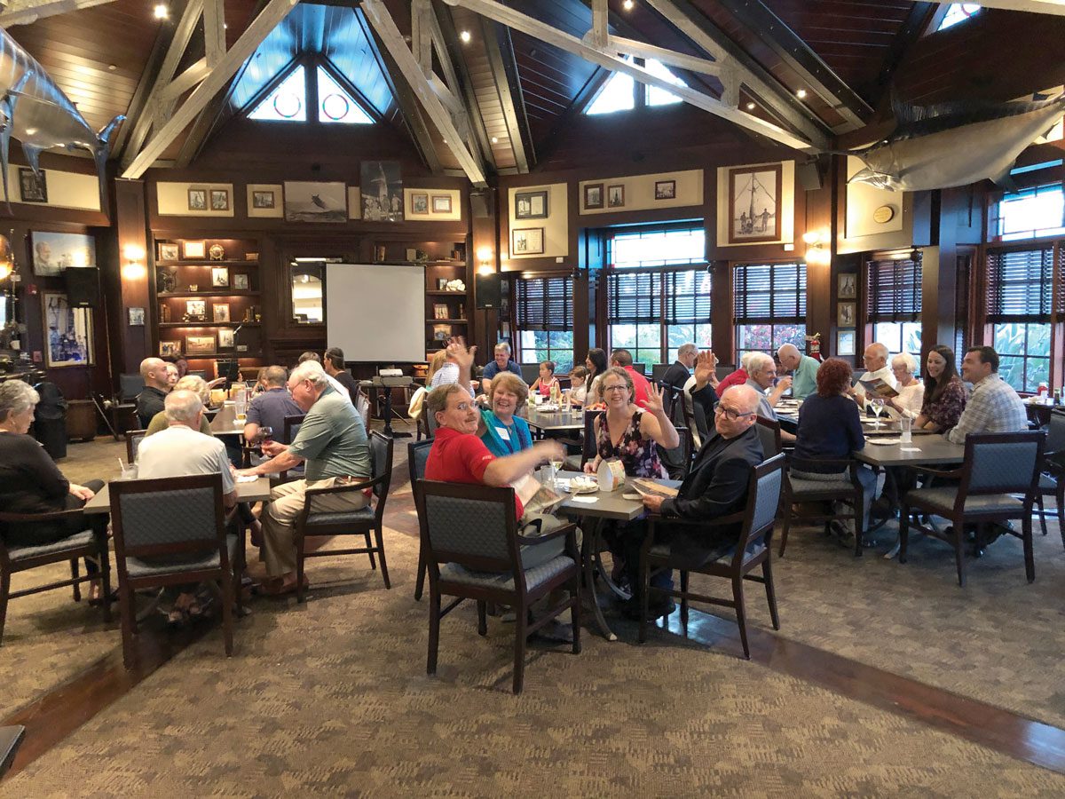 Southern Florida Alumni sitting at tables at dinner event