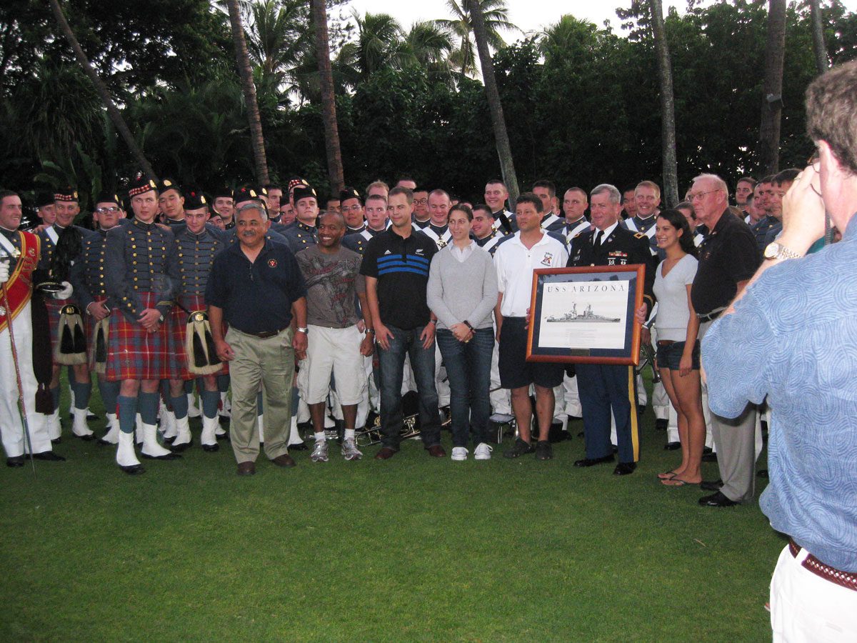 Hawaii chapter alumni holding image of USS Arizona