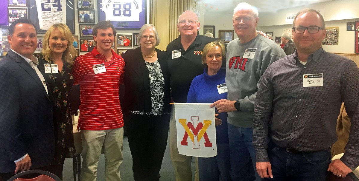 Upstate Pigsah chapter alumni holding VMI flag