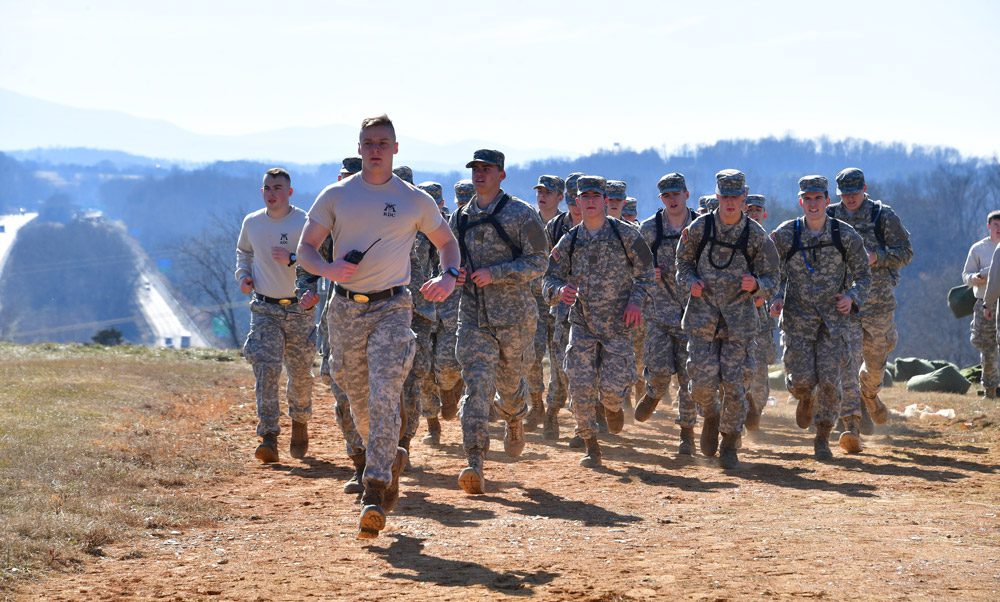 soldiers running uphill
