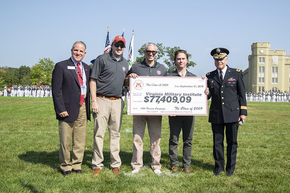 Members of the Class of 2009 pose with Steve Maconi and Gen, Peay, holding a large check to the Institute, courtesy of the Class of 2009.