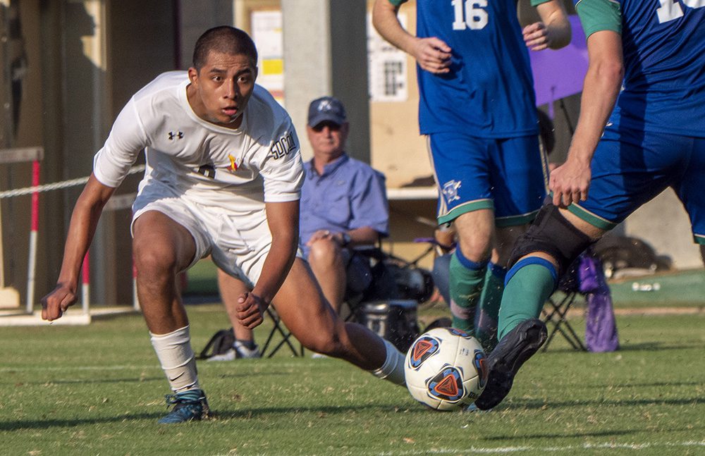 male soccer player mid-play