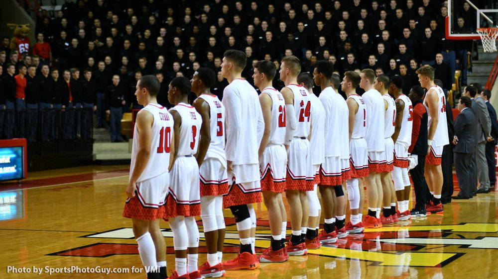 basketball players lined up at half-court