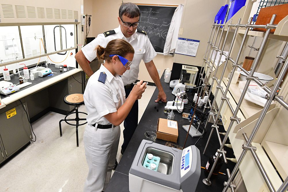 cadet and professor doing work in chemistry lab