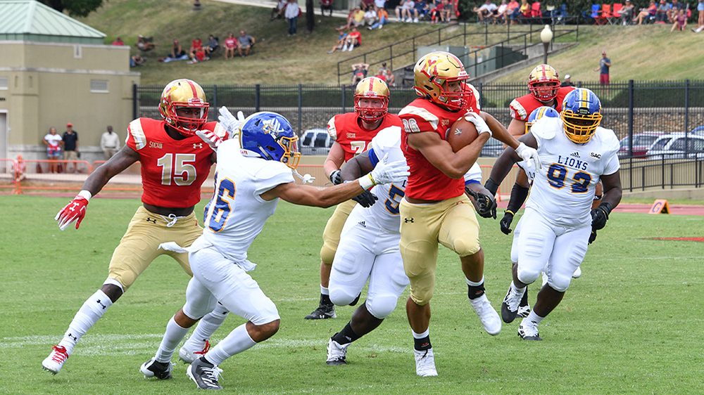 players in the middle of a football game