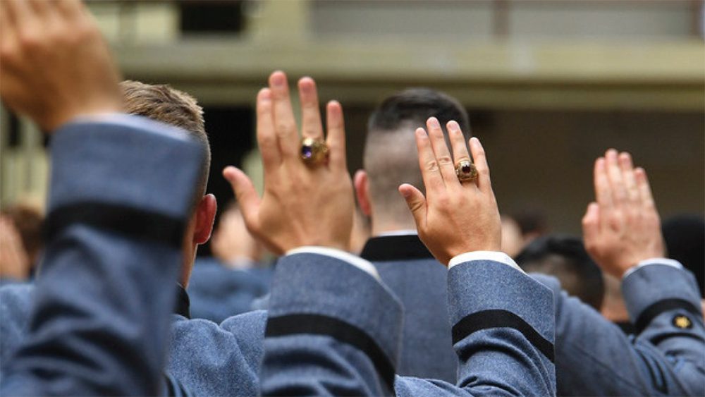 close up of cadets' hands raised