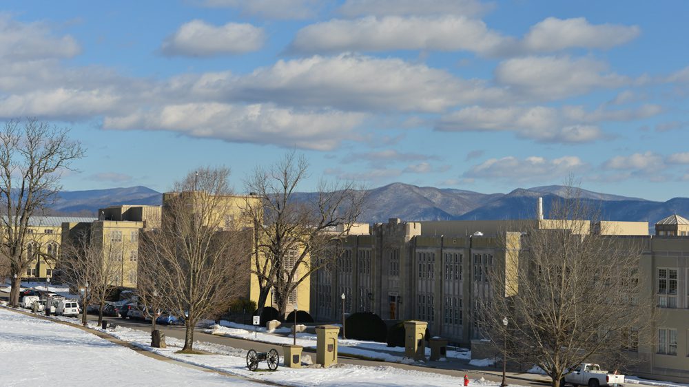 wide shot of academic row with mountains in the background