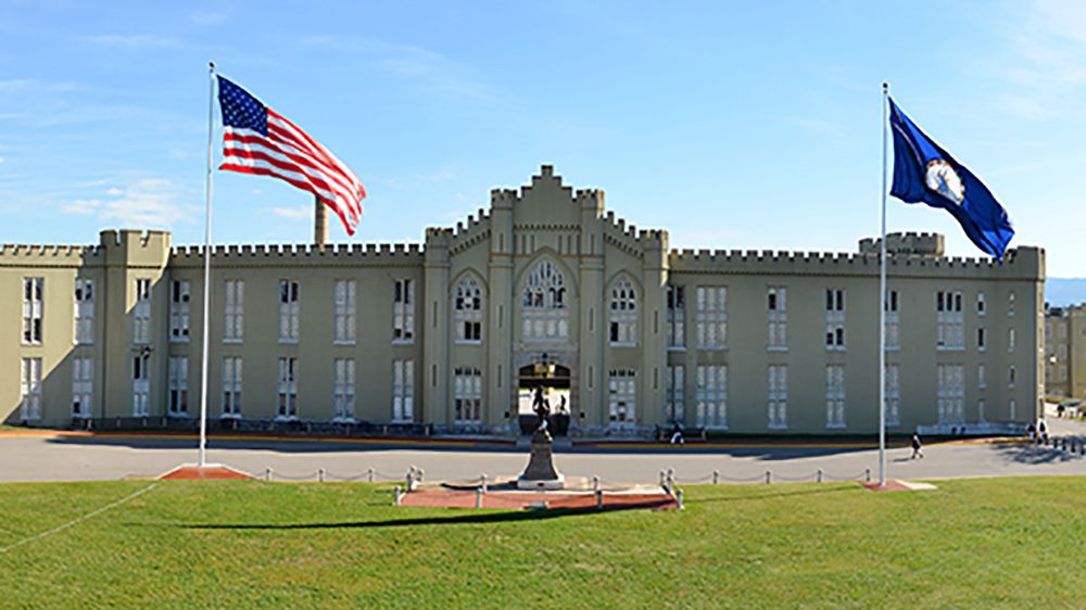 old barracks with flags on either side