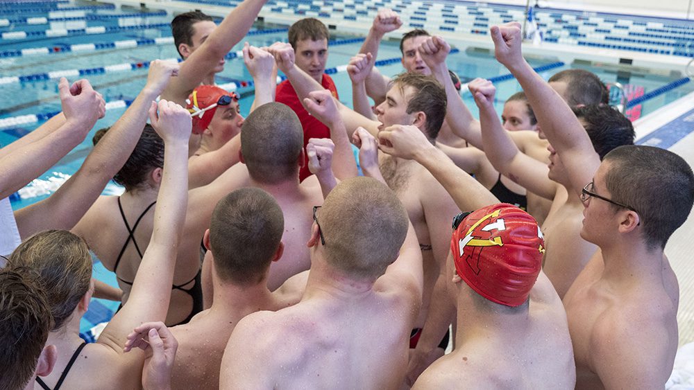 swim team gathered, cheering