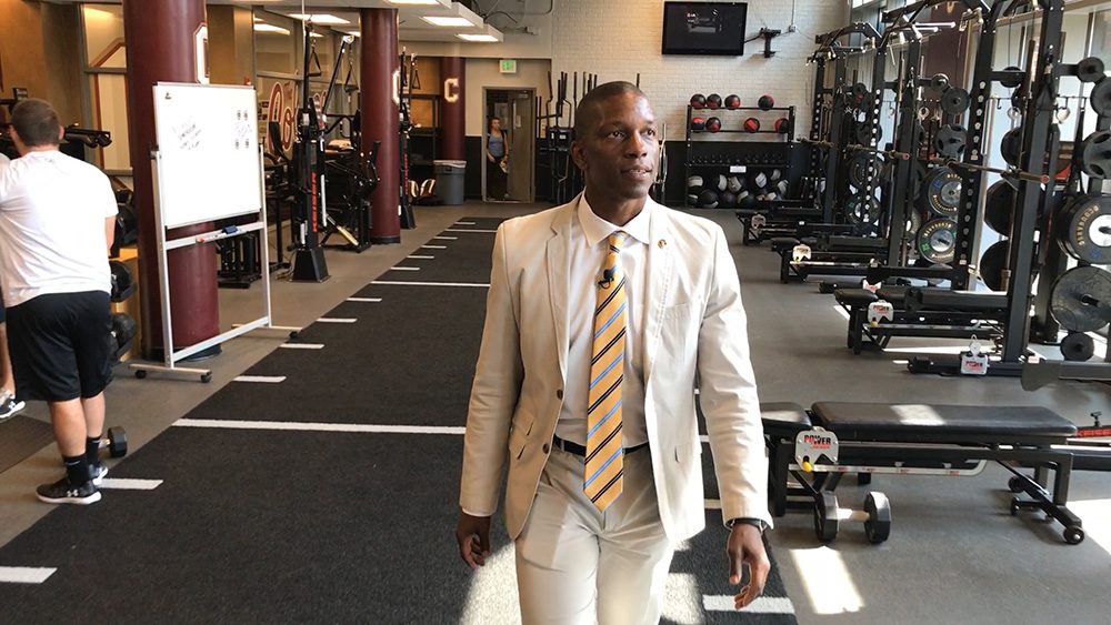 man standing in weight room