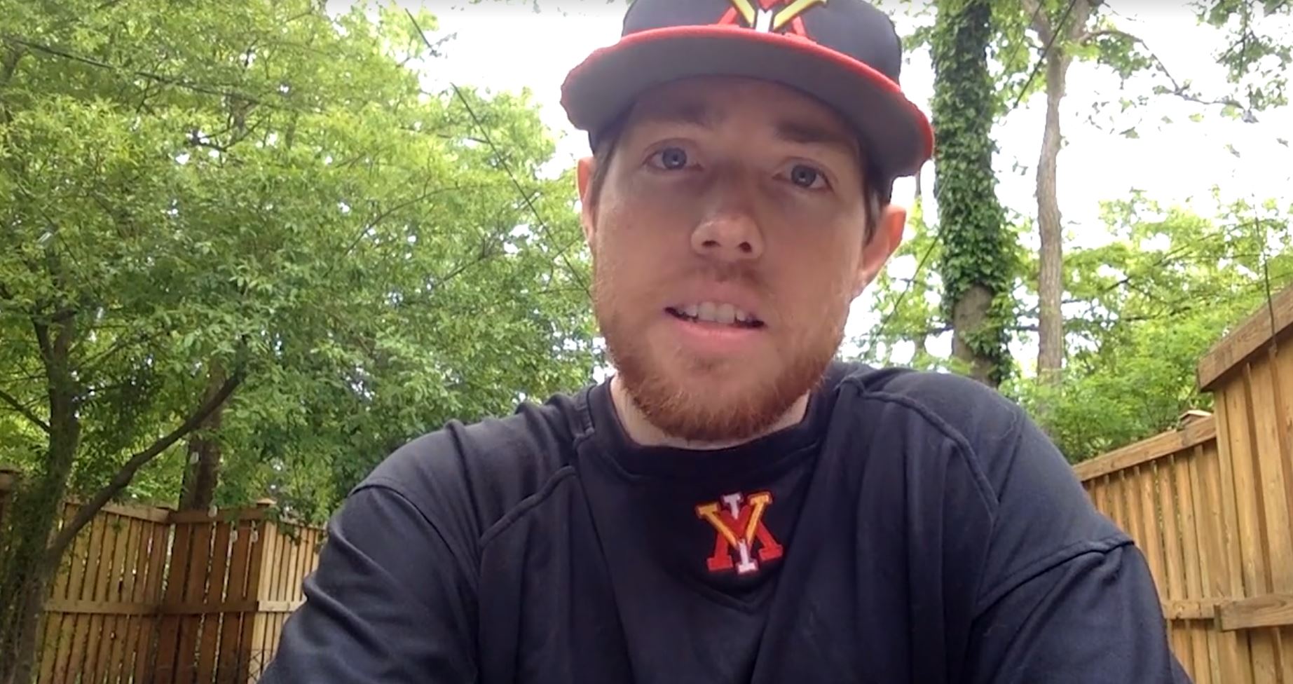 man wearing VMI hat and shirt