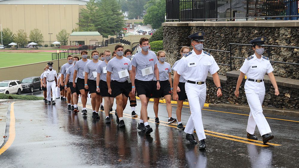 cadets in gym dyke and masks marching on street