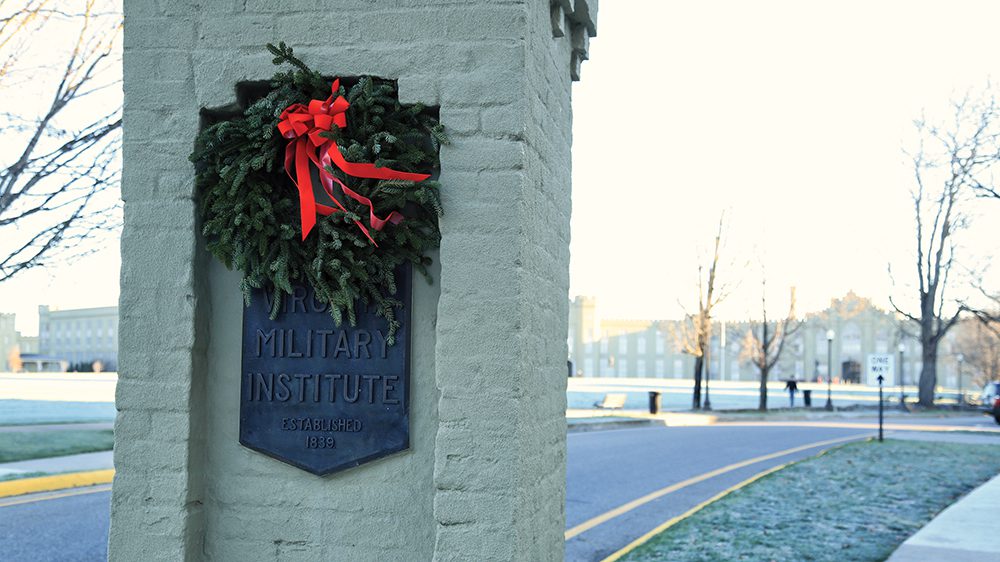 wreath on column in front of post