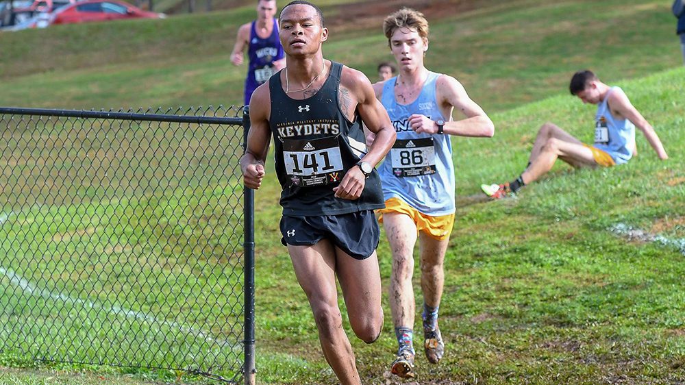 Two track athletes running outdoors