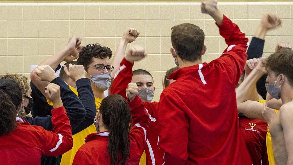 Athletes cheering with first in the air