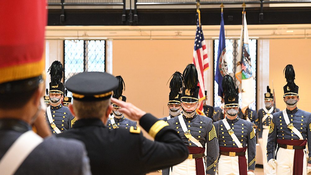 man saluting the Corps of Cadets