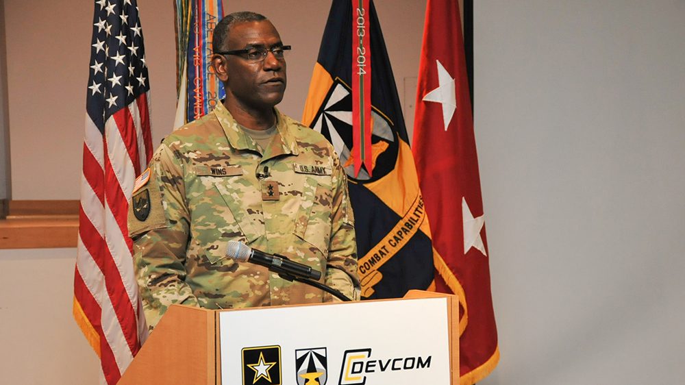 Maj. Gen. Wins standing behind podium