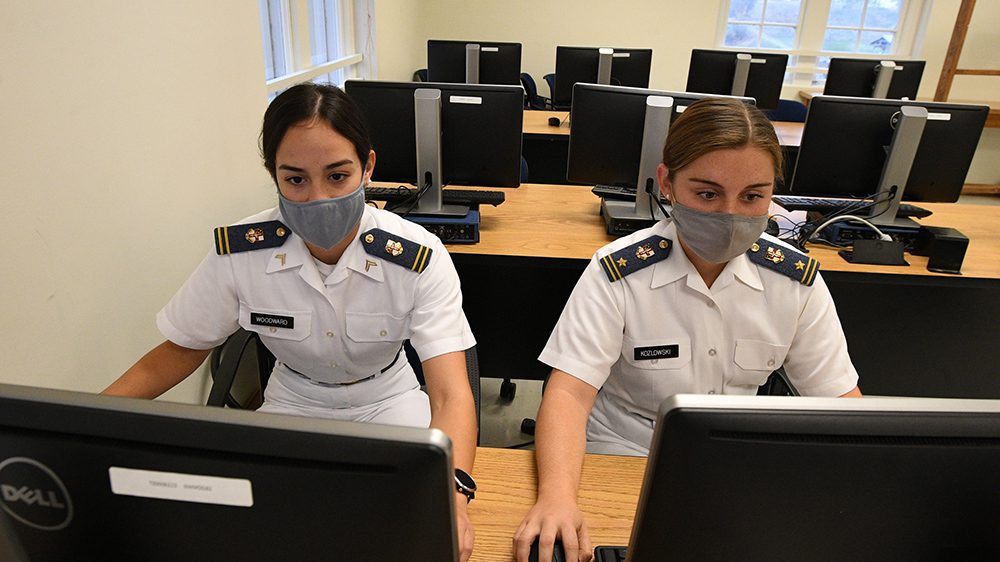 two cadets using computers