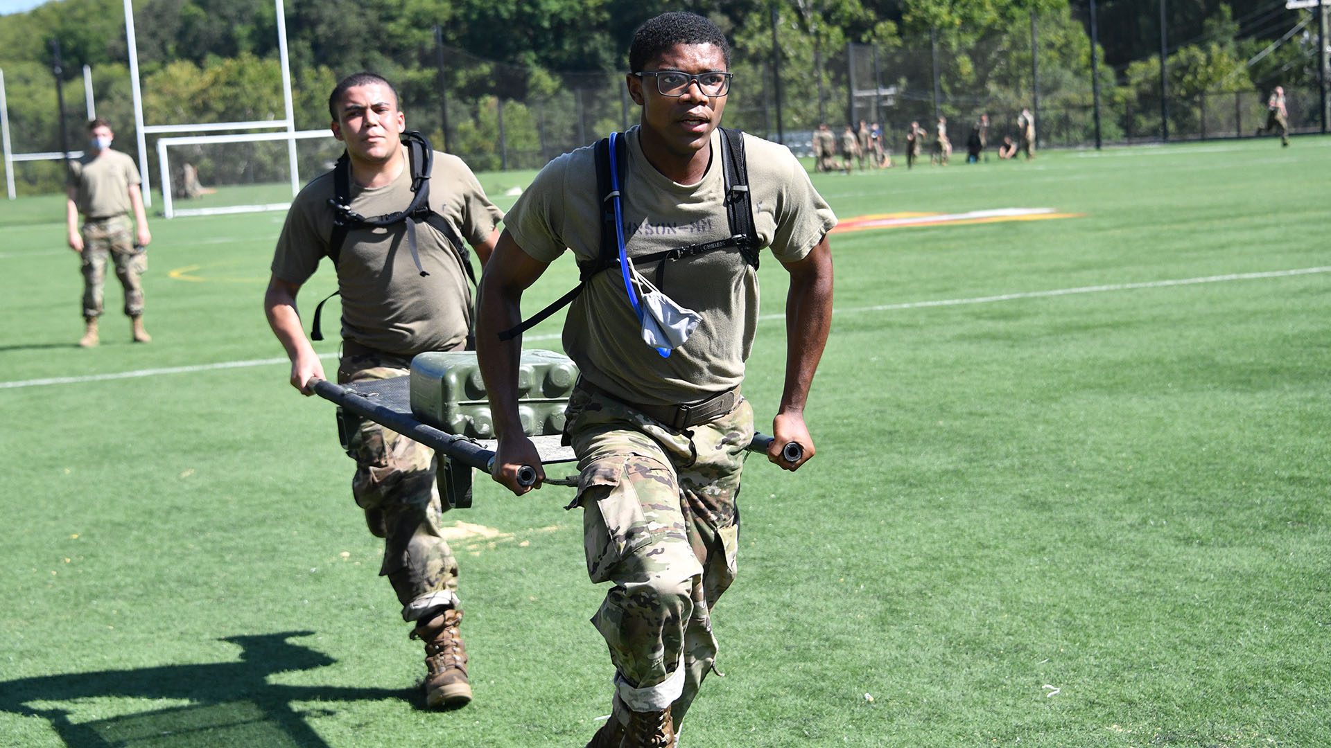 cadets running and carrying gurney