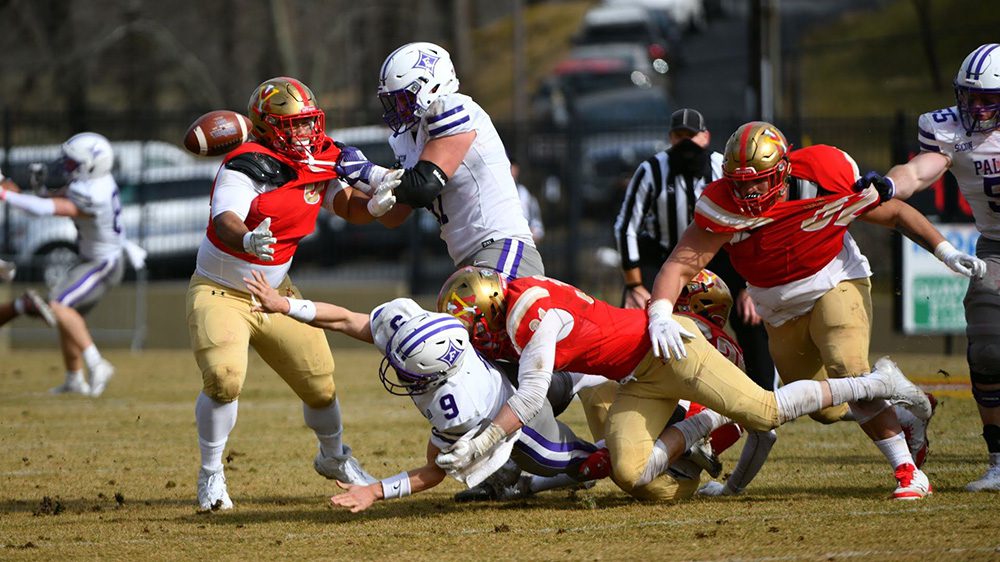 football players being tackled